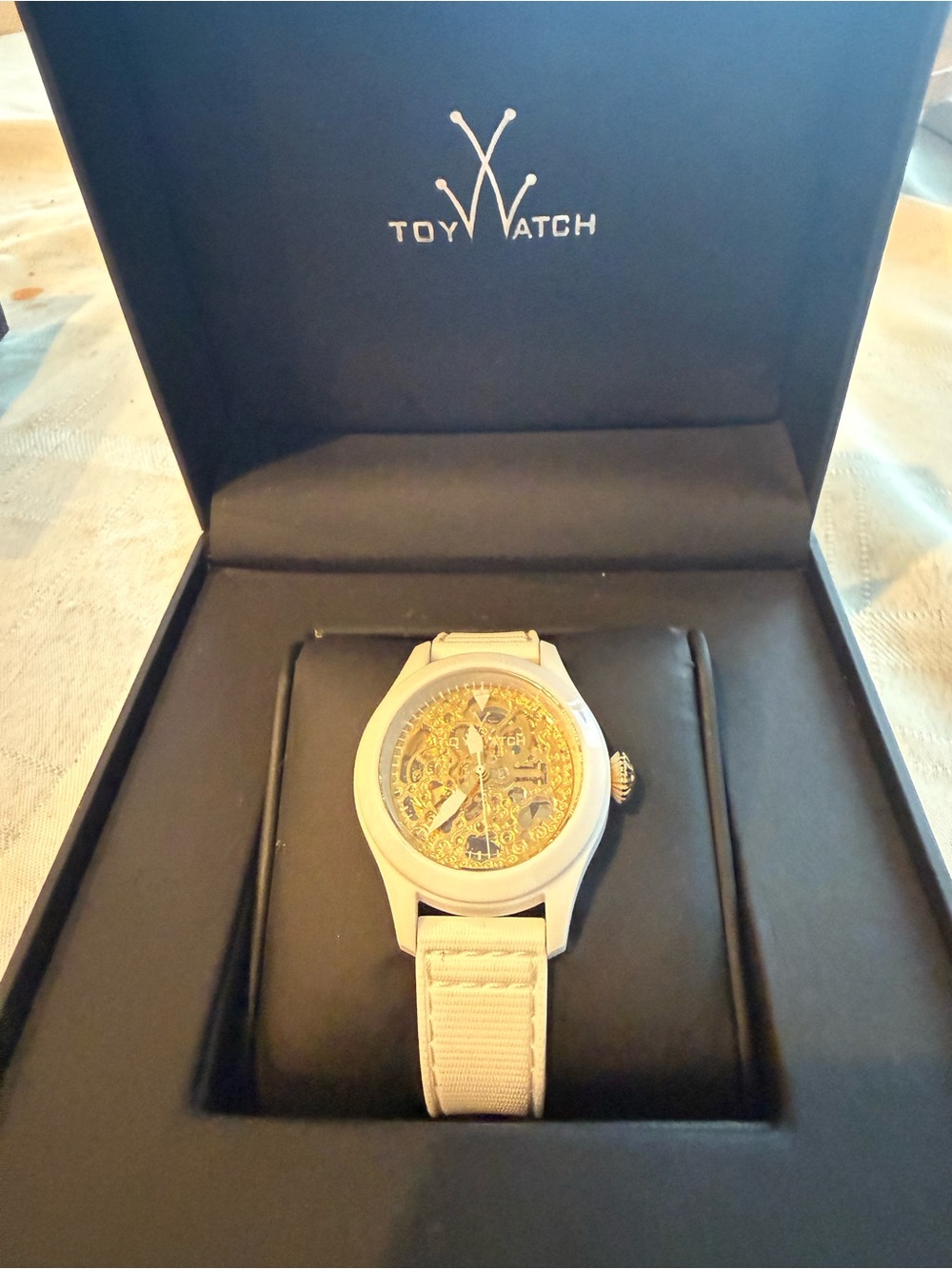 ToyWatch Men's White Strap Watch with Gold Skeleton Dial